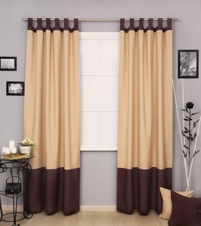 Beige loop curtains with dark brown trim in dubai