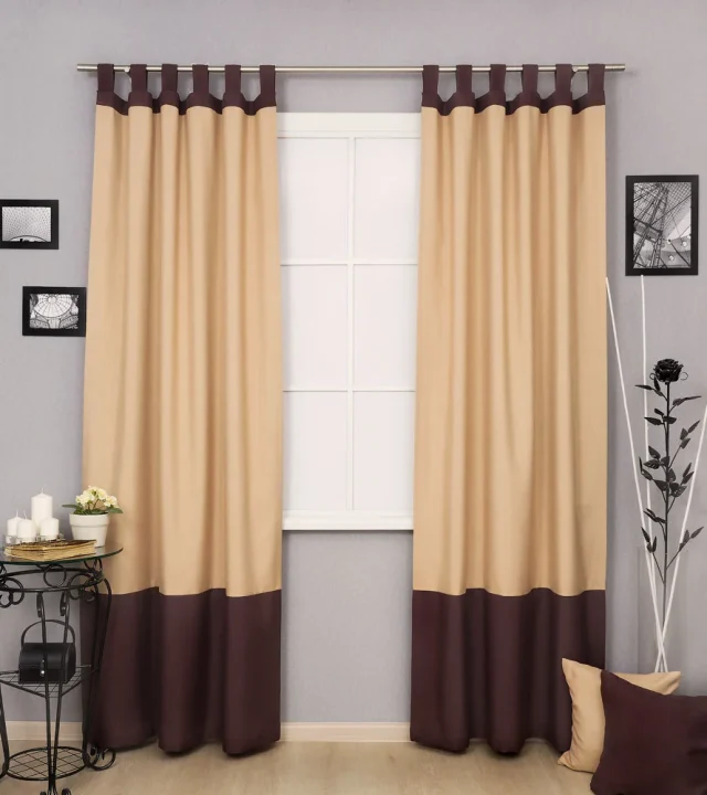 Beige loop curtains with dark brown trim in dubai Beige loop curtains with dark brown trim in dubai